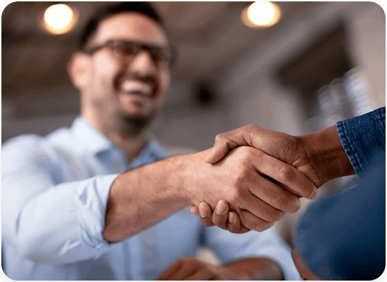 A consumer shaking hands with a Your Health Idaho-certified agent who is providing no-cost assistanc&hellip;